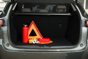 Set of car safety equipment in trunk, space for text © New Africa