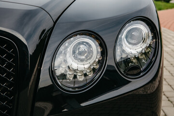 Front laser headlights of luxury car close -up