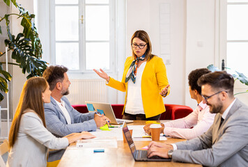 Group of business people having a meeting in office.