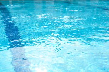 Outdoor swimming pool with clear rippled water