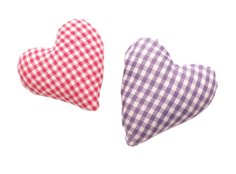 Close up of two checkered fabric heart shapes