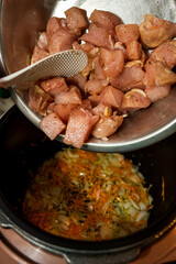 Raw pork pieces marinated in bowl