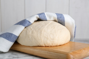 Fresh yeast dough on white marble table