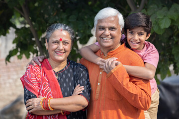Grandparents with grandson enjoying the sunny day.