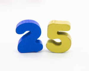 25 colorful wooden numbers decorative on the white
