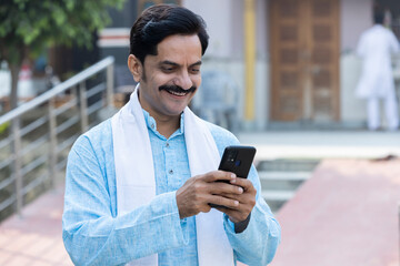Indian farmer using smart phone