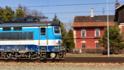 Naklejka premium A fast moving train leaves the station.