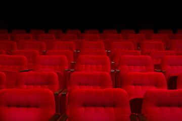 Empty cinema hall with comfortable red seats