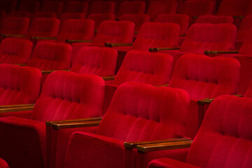 Empty cinema hall with vintage red seats