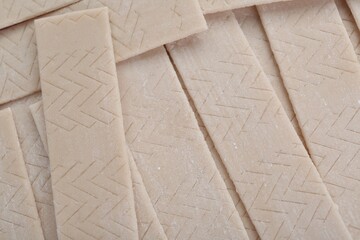 Sticks of tasty chewing gum as background, top view