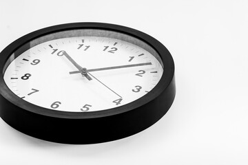 Black and white clock. Round wall clock - time to work concept