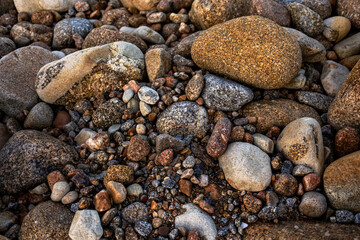 Natural and beautiful background of pebbles on the ocean shore
