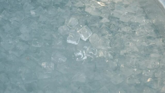Man preparing ice bath.