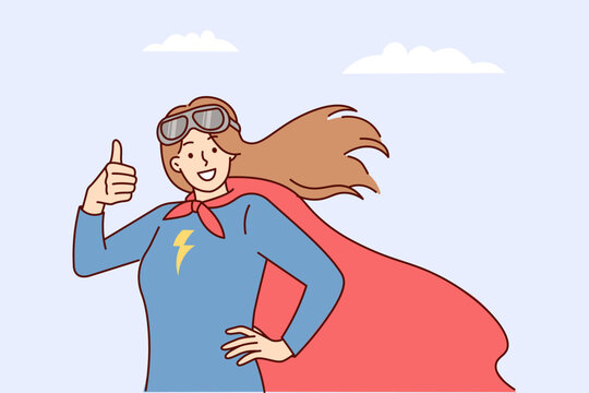 Woman superhero with picture of lightning on chest shows thumbs up on background of cloudy sky