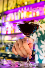 man hand bartender making cocktail in glass on the bar counter