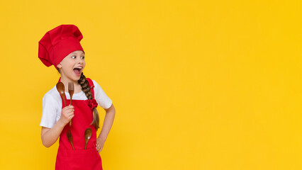 A little girl in a cook's costume, a baby cook breakfast in a chef's costume. The concept of...