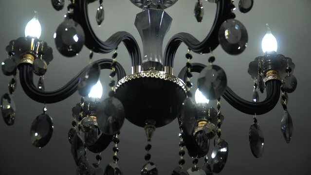 The chandelier swings from buildings shaking during an earthquake. Сlose-up