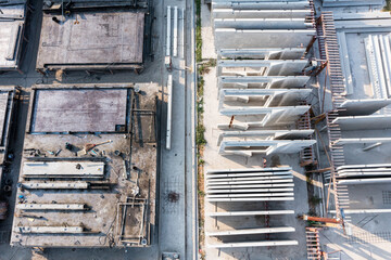 Aerial top view of Precast concrete wall panel for construction building site in warehouse factory. Precast concrete manufacturing products on prefabricated house factory