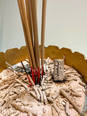 Incense sticks and incense sticks with numbers in the incense burner are lit for good luck.