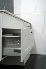 open drawer with metal slides at bathroom