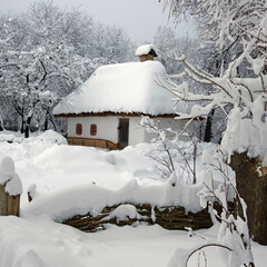 Naklejka premium Landscape with clay house in the snow.Ukraine,Kiev,Museum,square