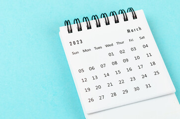 The March 2023 Monthly desk calendar for 2023 year on blue background.