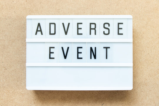 Lightbox With Word Adverse Event On Wood Background