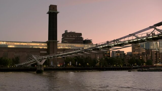 Millennium Bridge and Tate Modern at evening twilight in London