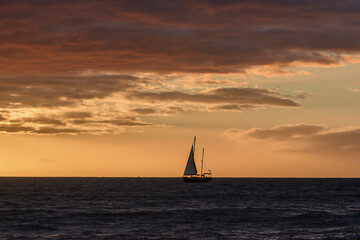 Old sailboat sailing on the sea at sunset, Grand Canary, canary islands, Spain