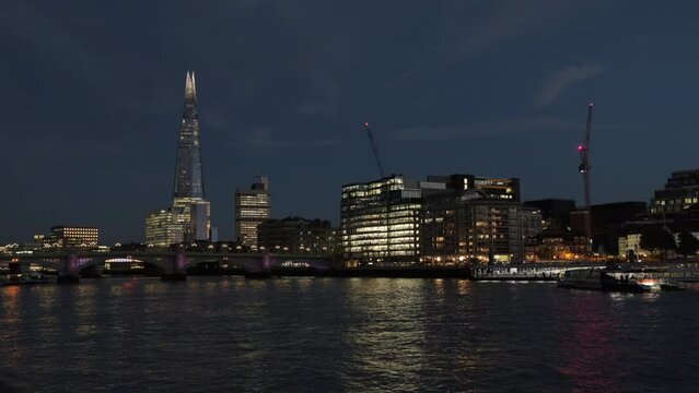 Blue hour twilight clip of London skyline with Shard and Thames River Bus