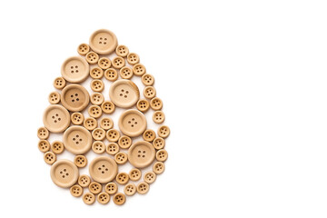 Easter egg on a white background. Easter background. Decorative egg. Easter egg made of buttons. Easter egg with your own hands.
