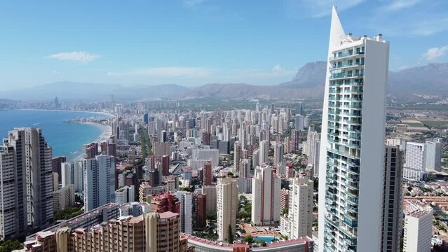 travel, tourism, real estate and business concept - aerial view of scyscrapers and hotels in Benidorm, Spain