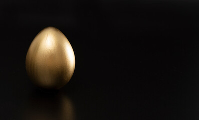 Easter, Gold birds eggs shot against a dark background	
