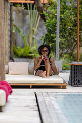 Woman relaxing on poolside