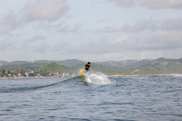 Fototapeta Indonesia, Lombok, Male surfer enjoying with sea waves� obraz
