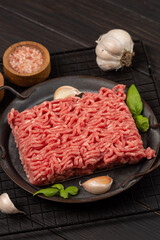 Raw homemade minced meat on a tin plate