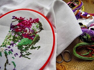 embroidery with colored thread on white fabric