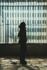 A girl in urbex exploration, Santa Chiara Village, Sardinia