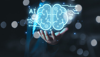 businessman holding brain of AI, Symbolic, Machine learning, artificial intelligence of futuristic technology. AI network of brain on business analysis, innovative and business growth development.