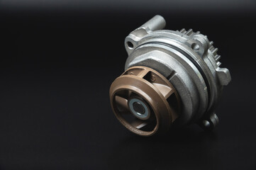 Spare part. Mechanical water pump for engine cooling. On a black background