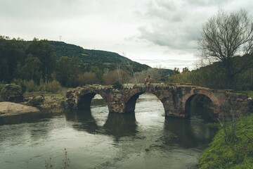 Fototapeta na wymiar Old Roman Bridge in Sardinia, Allai