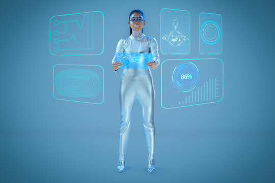 A model dressed as a robot wearing silver, futuristic  clothes holding a virtual  tablet, with virtual icons . A future technology concept