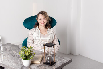 Smiling woman psychologist on workplace. Space for text