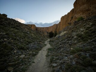 Arid barren badland, wild west desert landscape of Bannockburn Sluicings in former goldmine in Central Otago New Zealand