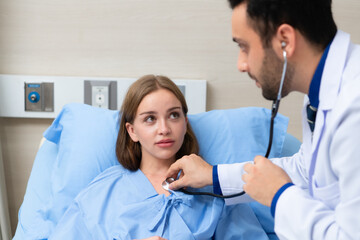 Fototapeta premium The doctor did a daily check-up and talked about the serious illness that had happened to the girl. to know the progress of treatment