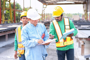 At building construction site supervisor check quality precast concrete panel before installation