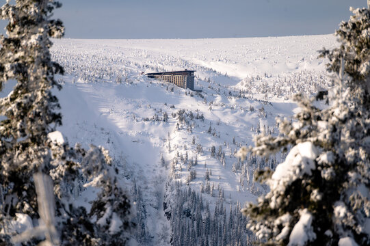 Krkonose mountains covered with snow. Hotel Labska bouda and Snezne Jamy in the distance.