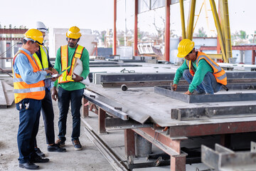 At construction site engineer check drawing correctness concrete mold before pouring concrete