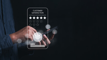 Business people or customers show satisfaction through the application on the smart mobile phone screen. By giving the most or the best satisfaction rating.Customer service satisfaction survey concept