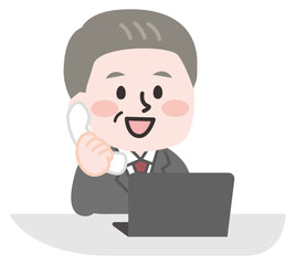 デスクで電話をする会社員のシニア男性 